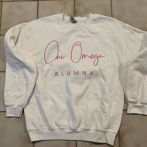 White and pink Chi Omega Alumna sweater
